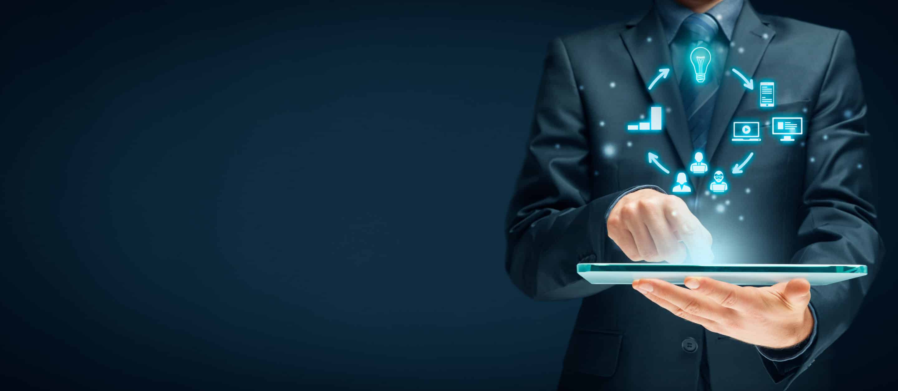 Person working on tablet, hologram showing digital marketing images and icons