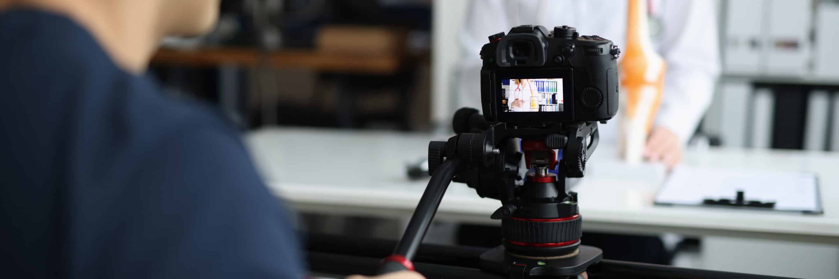 Videographer is filming doctor for online consultation and training. Medical channel TV show and education