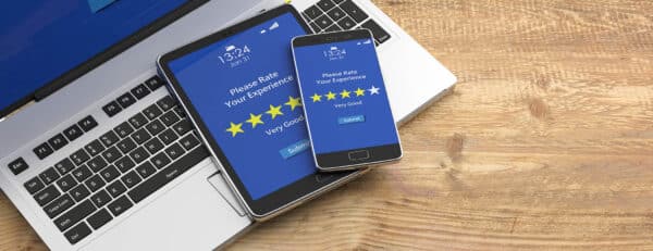 Good rating on tablet and mobile device screens, wooden background