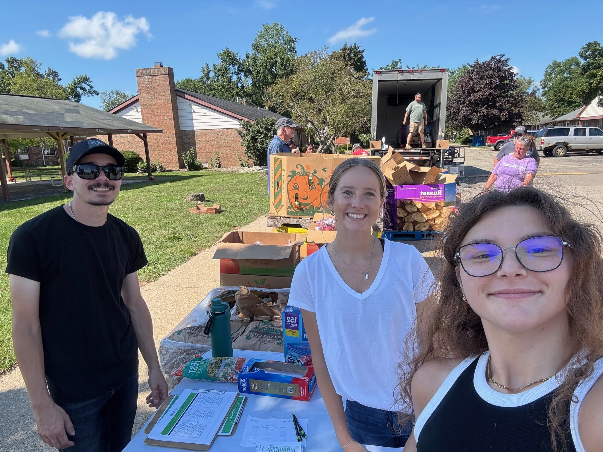 Sarah, Gabby, Alex Food Bank - 2025 team volunteering at food bank